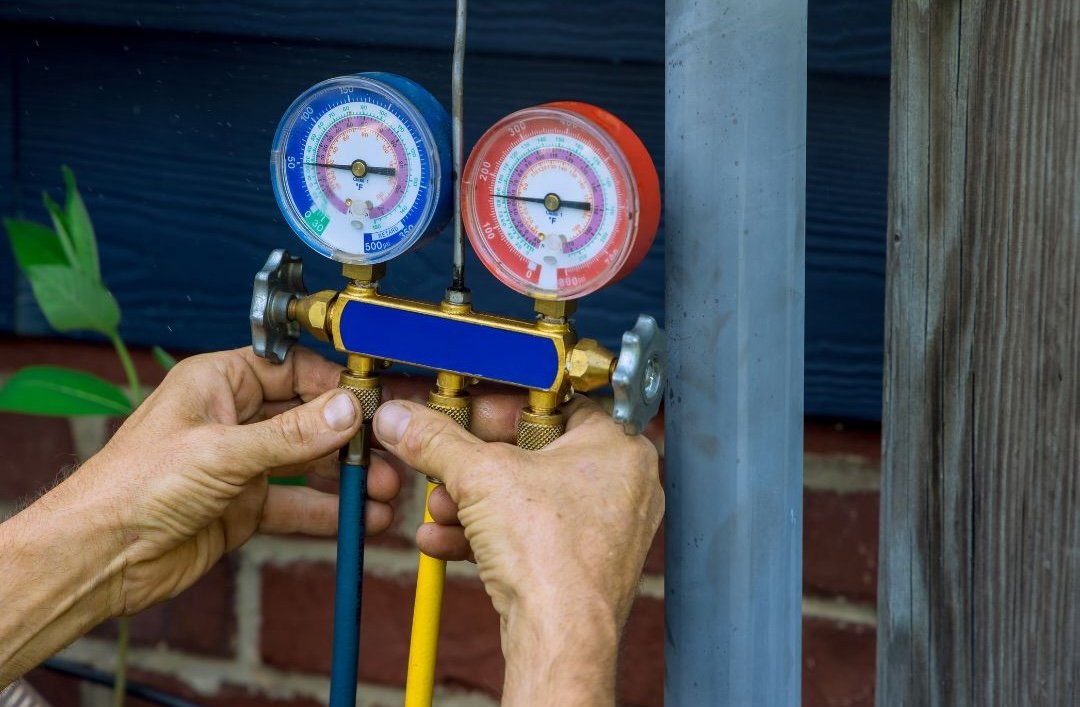 Heating and AC Service expert testing Gauges