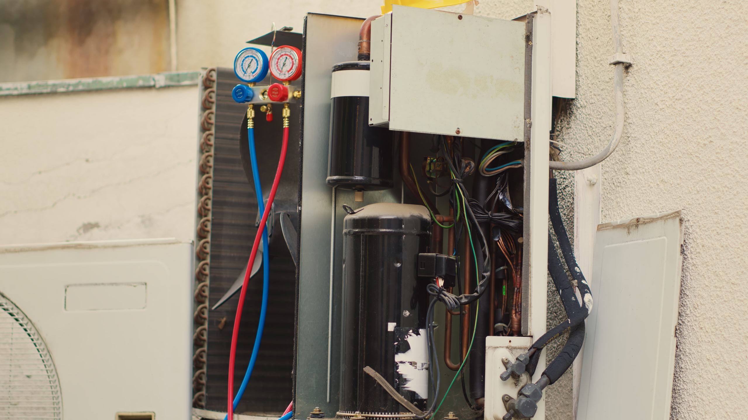 AC maintenance technician servicing unit in Miramar Beach FL