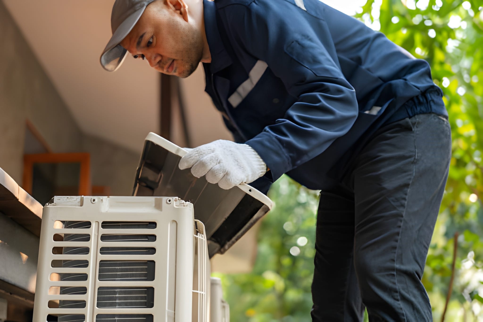 HVAC technician installing coastal air conditioner